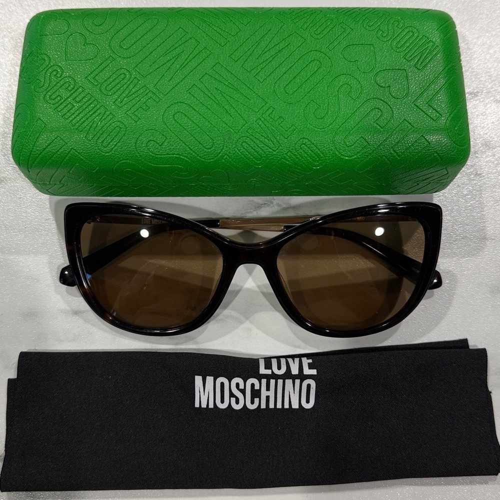 Love Moschino Black Cat Eye Sunglasses with Green Case